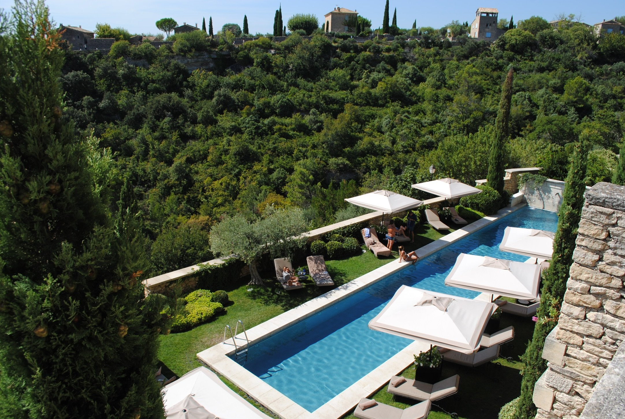 A poolside lounge area in warm light.