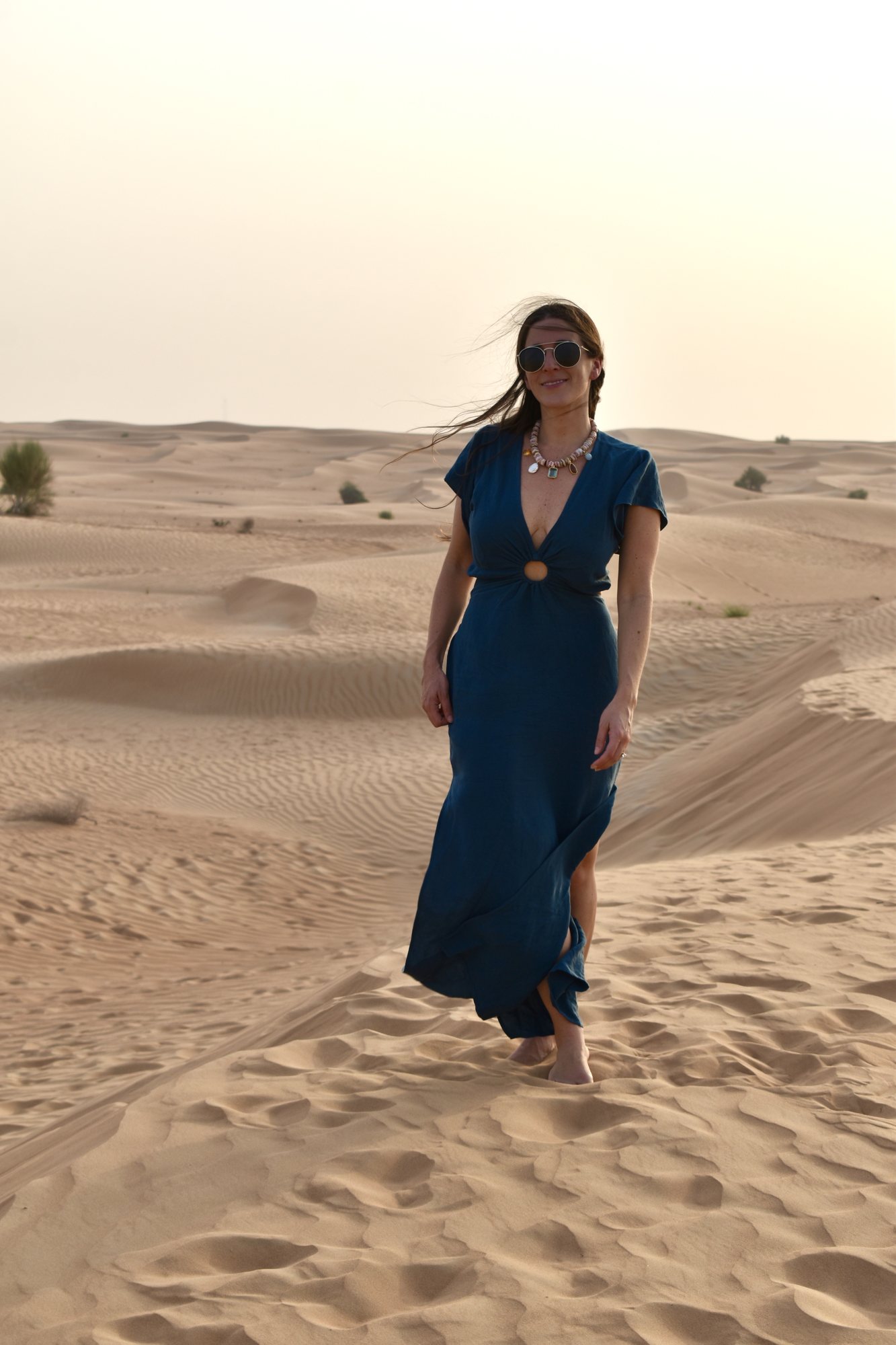 Julia walking the dunes outside Dubai.