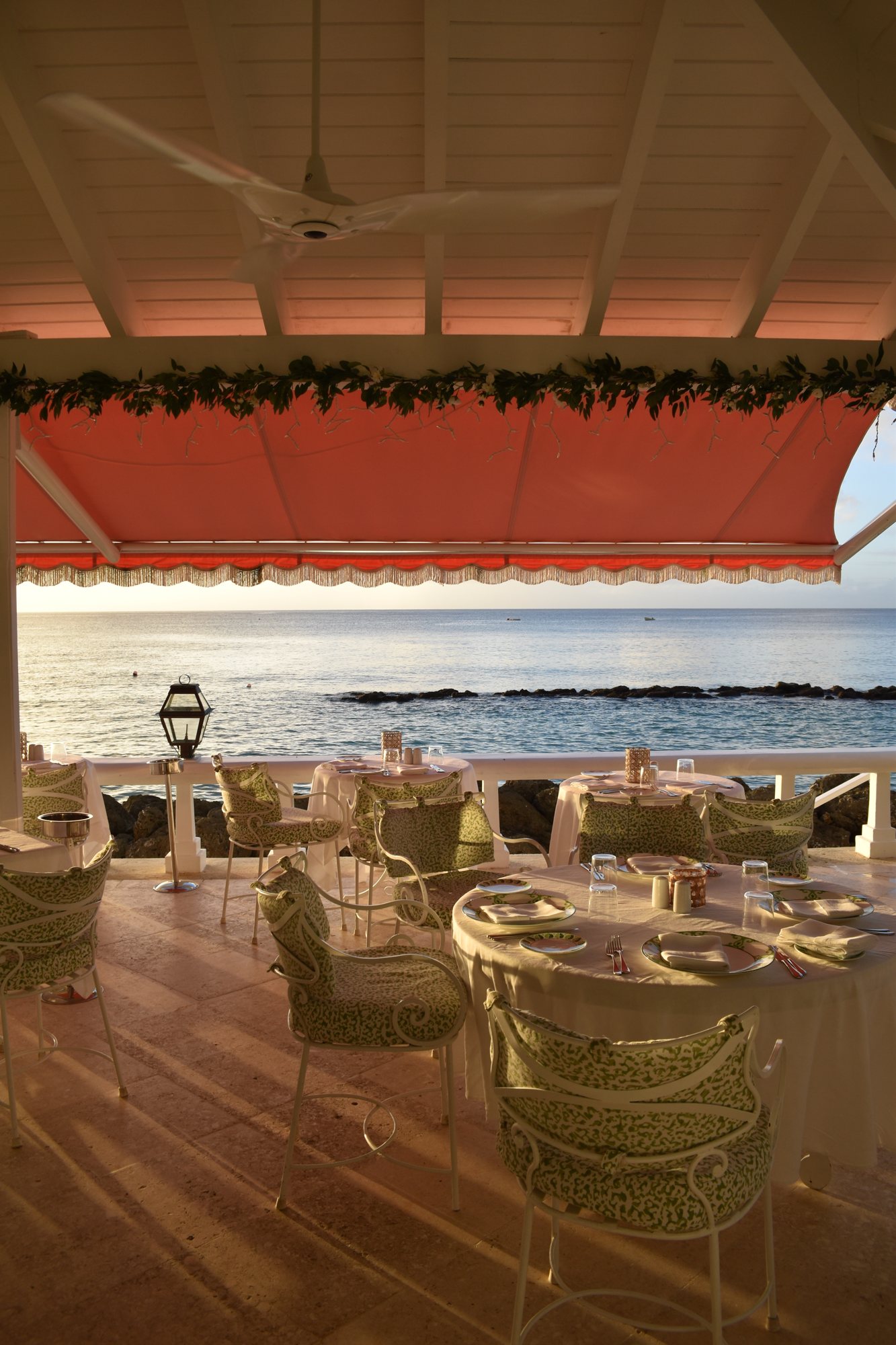 The rose-pink dining room at Cobbler's Cove.