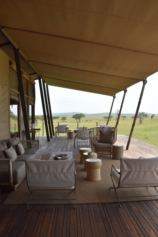 A tented suite lounge opening onto the savannah.