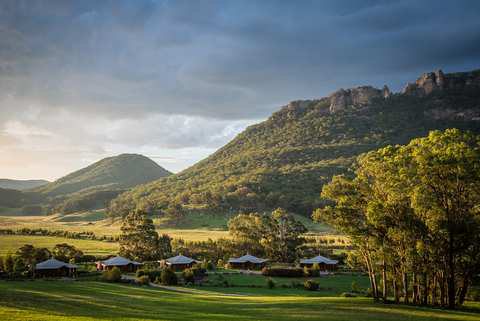 Lodge villas scattered through the green Wolgan Valley.