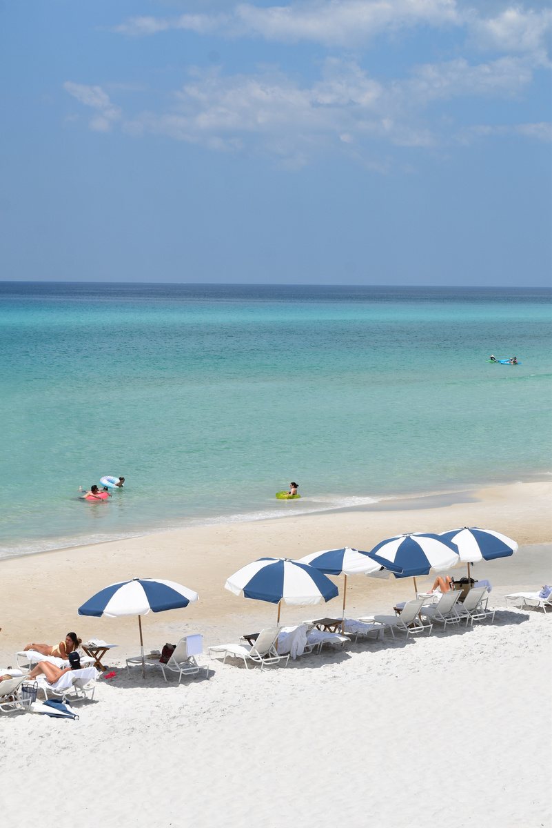 Striped umbrellas on a quiet beach.