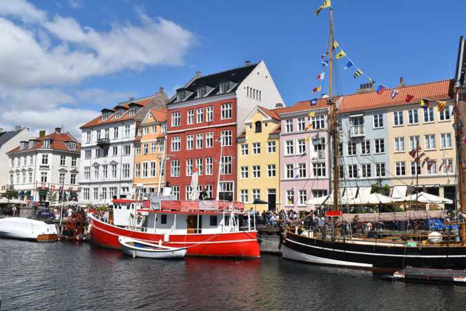 Colorful canal houses and boats in Copenhagen.