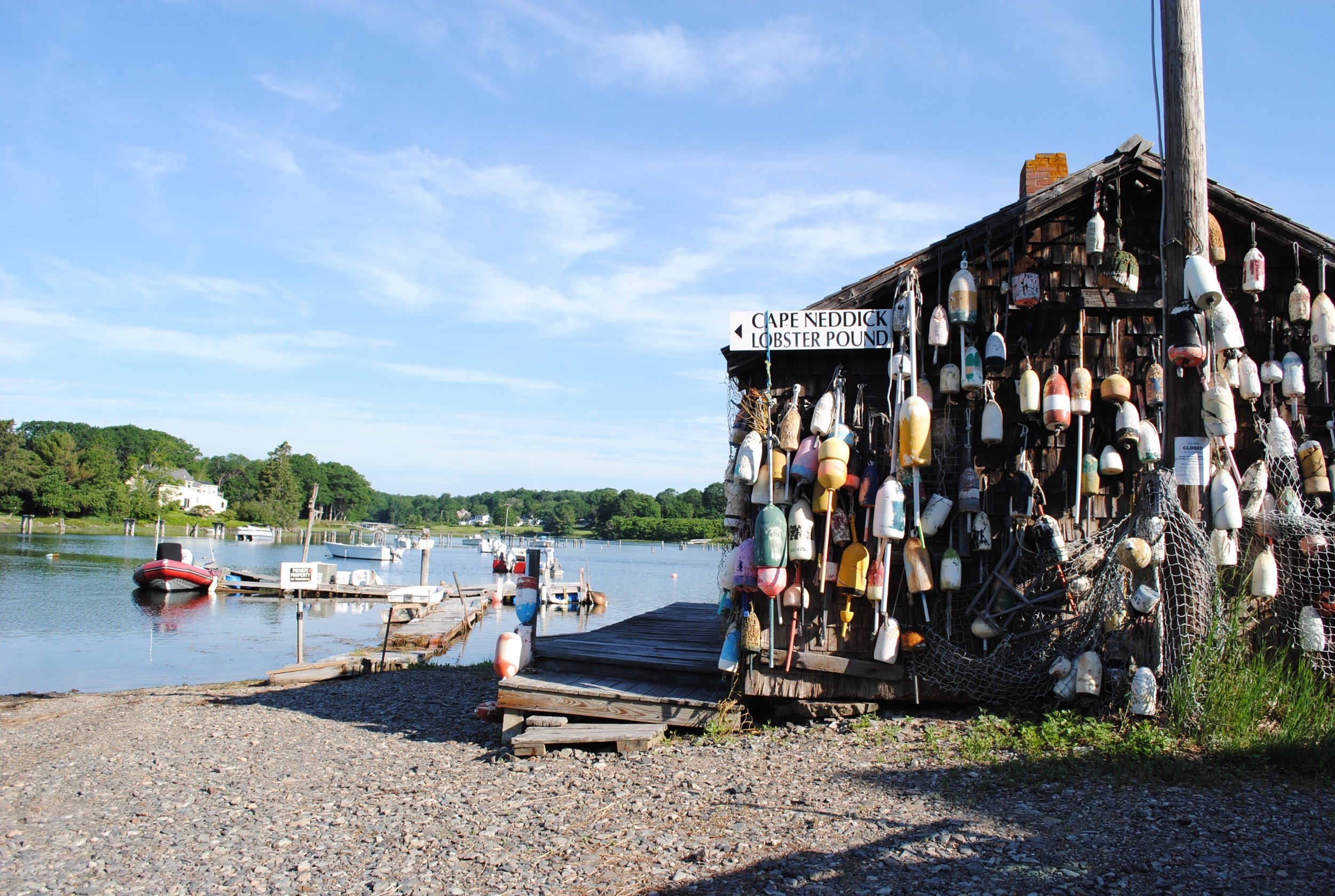 A wooden structure decorated with colorful ribbons.