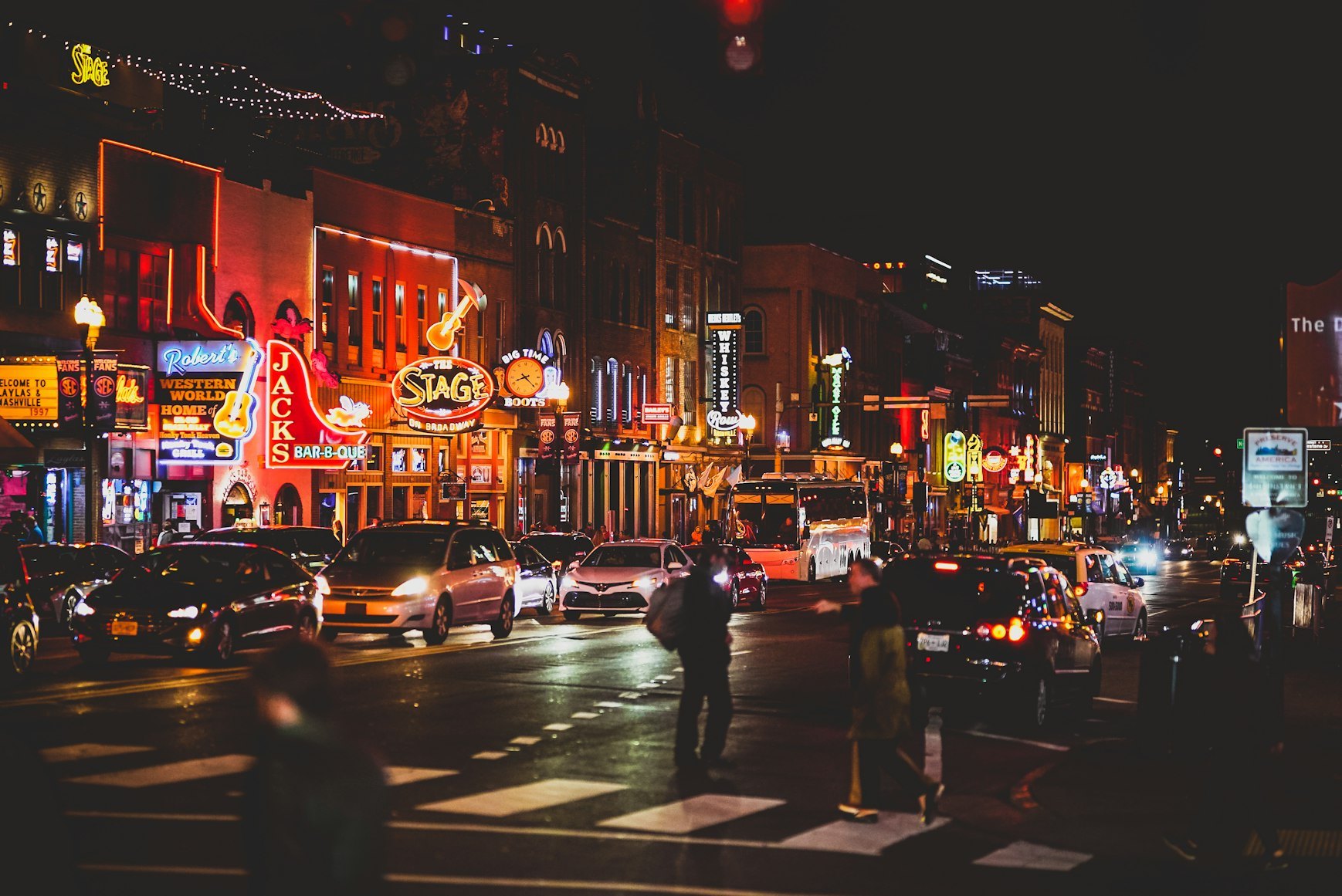 Lower Broadway's neon signs at night.