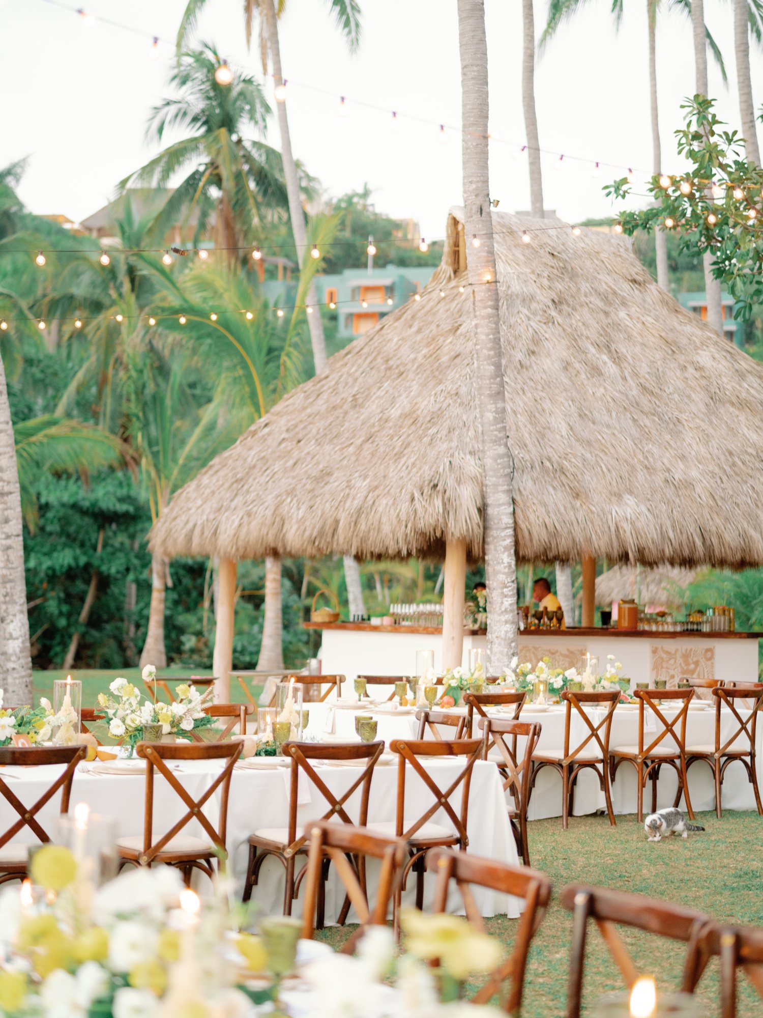 A palapa dressed for a destination wedding reception.